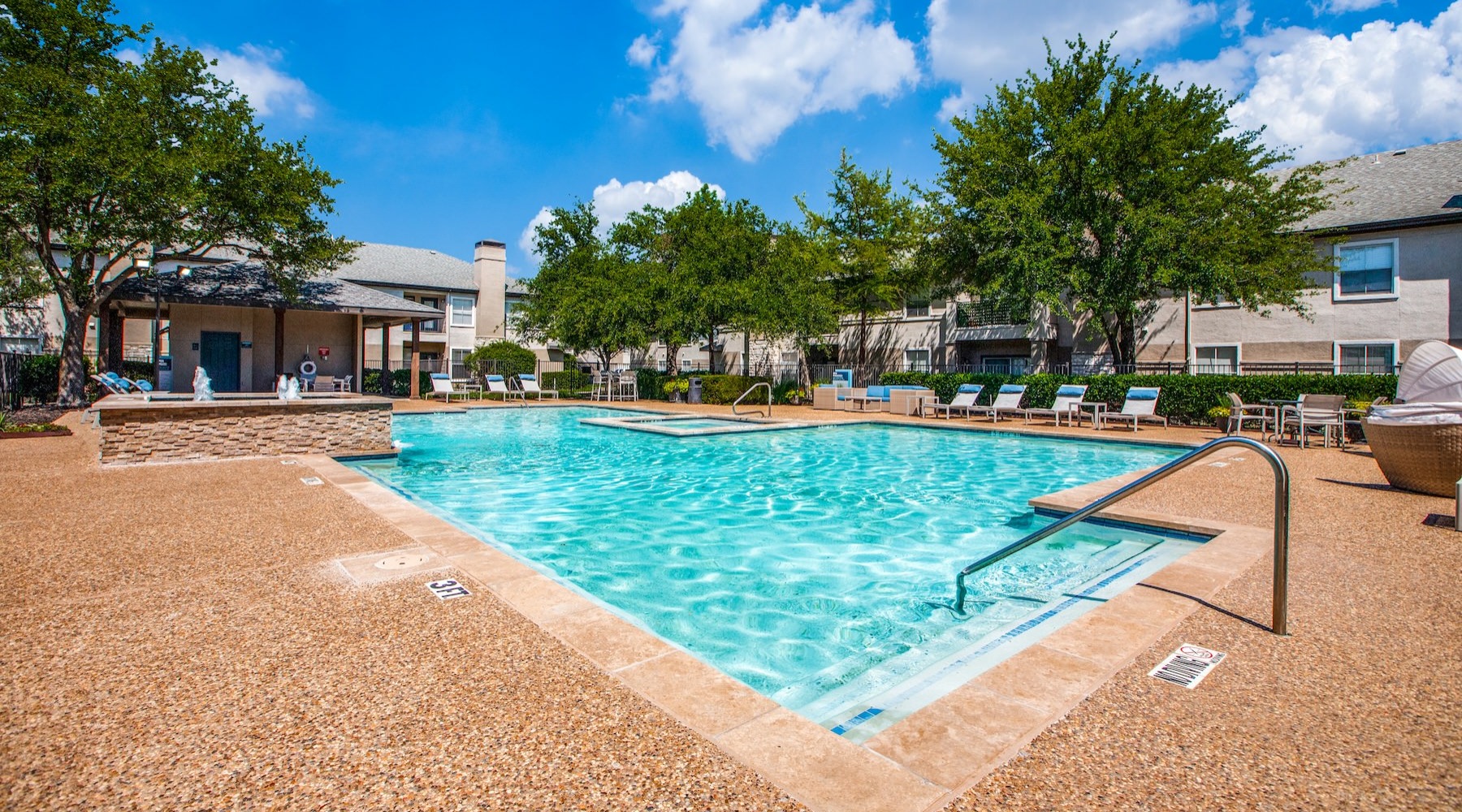 a pool with a building in the background