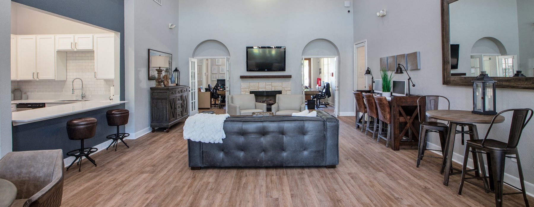 a clubroom with a tv and couches