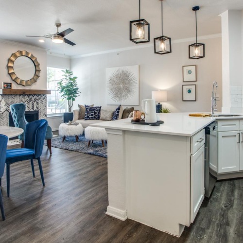 a kitchen with a dining table and chairs